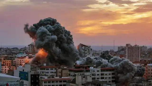 Israeli military forces prepare for a potential invasion of Gaza amidst ongoing Hamas attacks, with Iran denying any involvement.